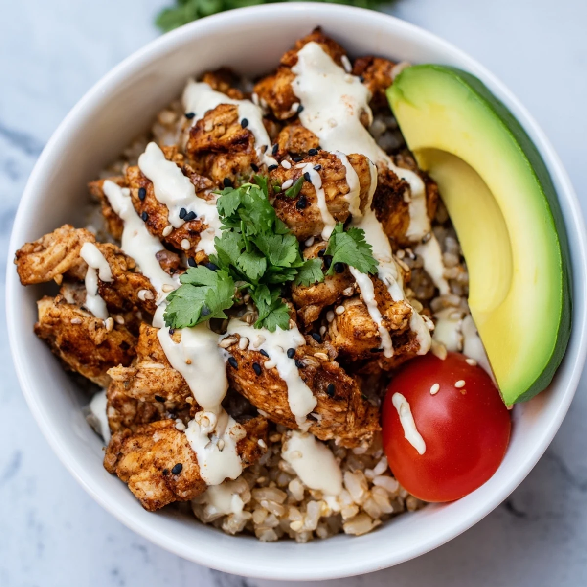 Assembled Spicy Lunch Bowl featuring fluffy brown rice, baby spinach, cherry tomatoes, cucumbers, and zesty spicy sauce, ready for a quick midday meal.