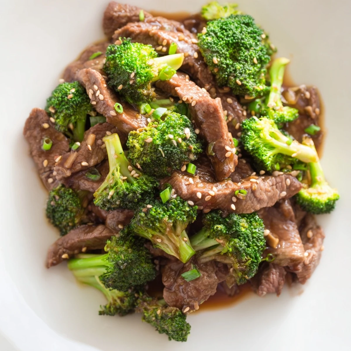 Sizzling Beef and Broccoli with Soy Sauce Glaze paired with fluffy jasmine rice and a sprinkle of sesame seeds.