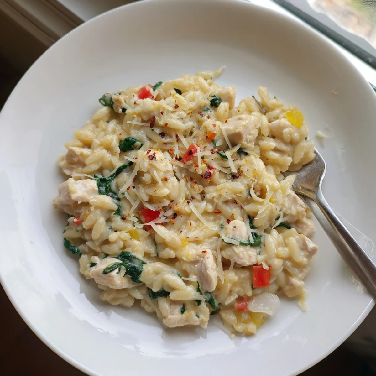 Creamy thirty minute cheesy chicken risoni served hot with grated Parmesan topping