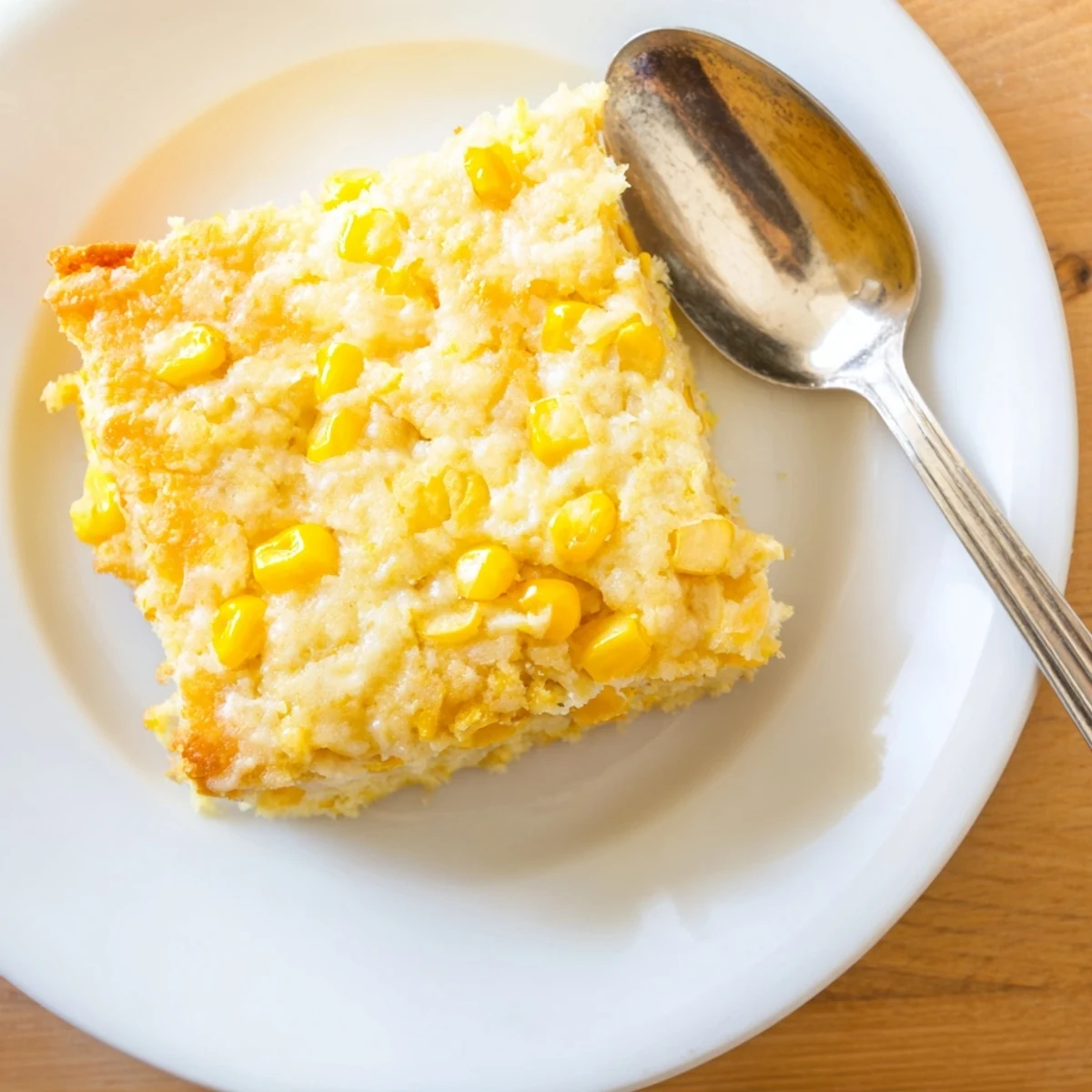 Creamy homemade Jiffy corn casserole served fresh from the oven in a baking dish