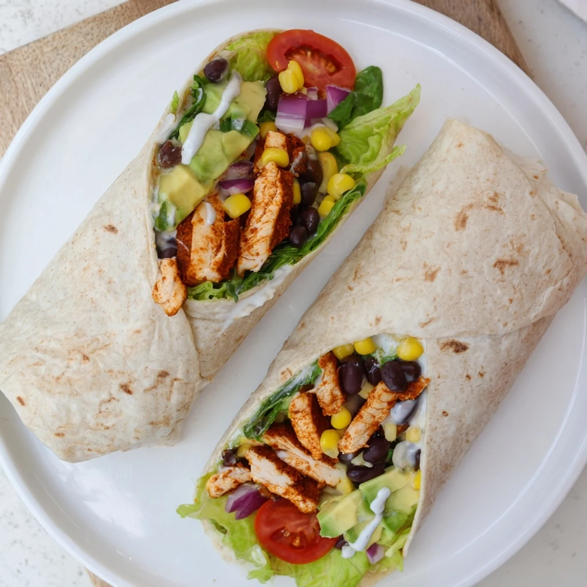 Vibrant zesty Southwest chicken wraps with spiced poultry, fresh vegetables, and tangy dressing ready to serve