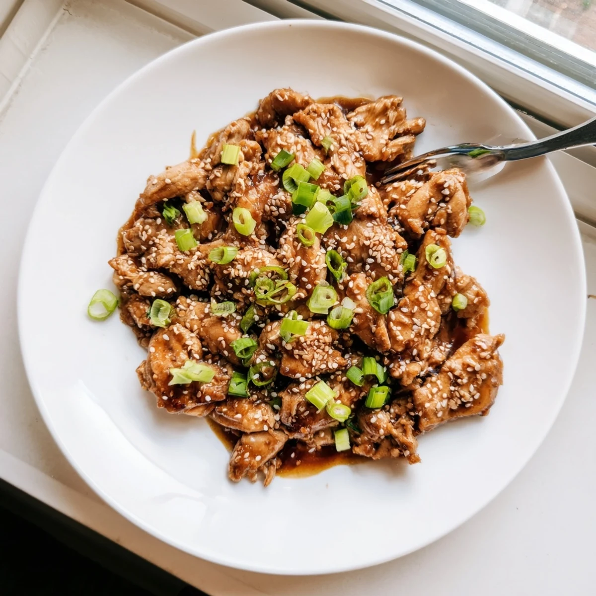 Golden brown Crockpot Teriyaki Chicken pieces swimming in thick sweet and savory glaze