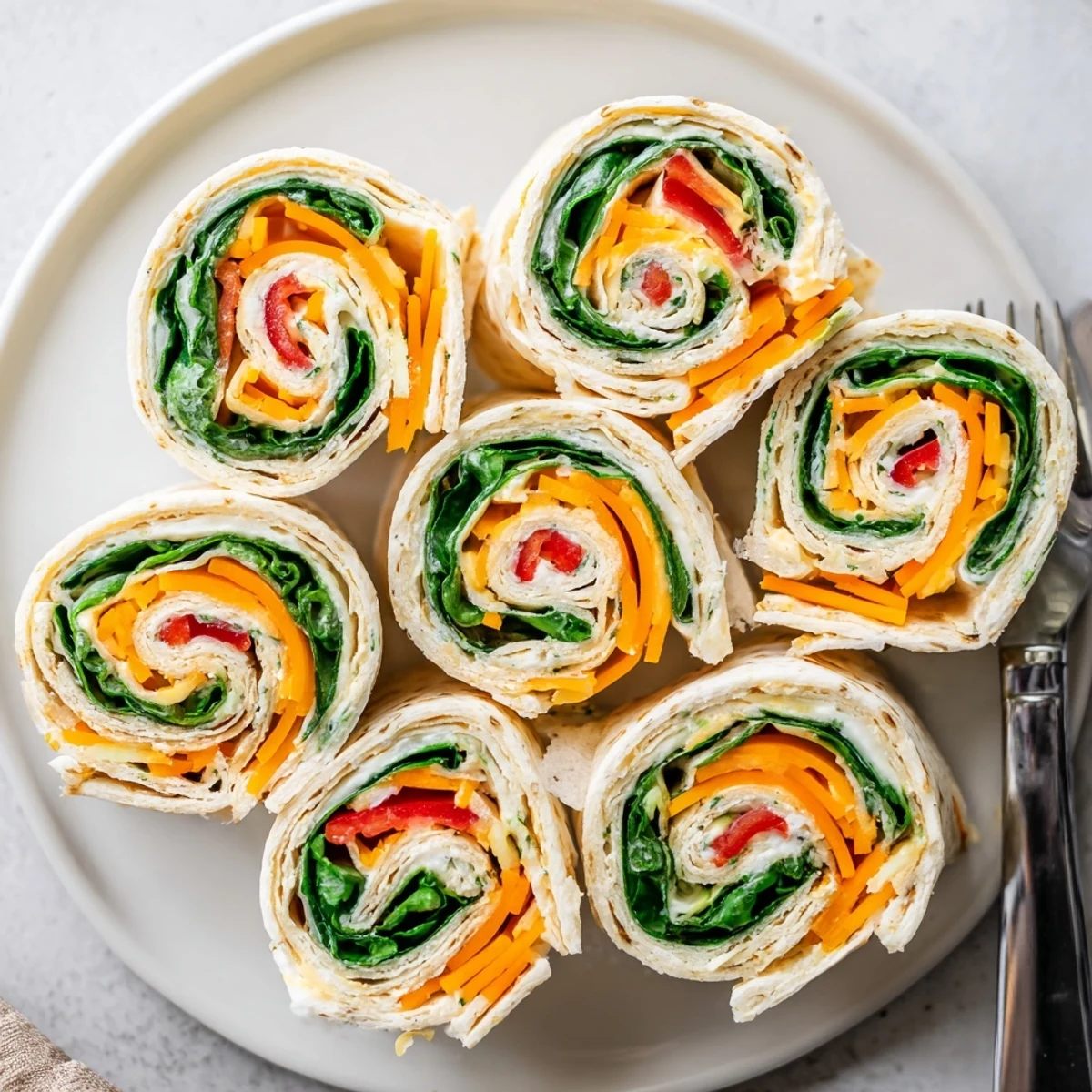 Chilled Pinwheel Sandwiches sliced into spirals, tender tortillas and crunchy carrots.