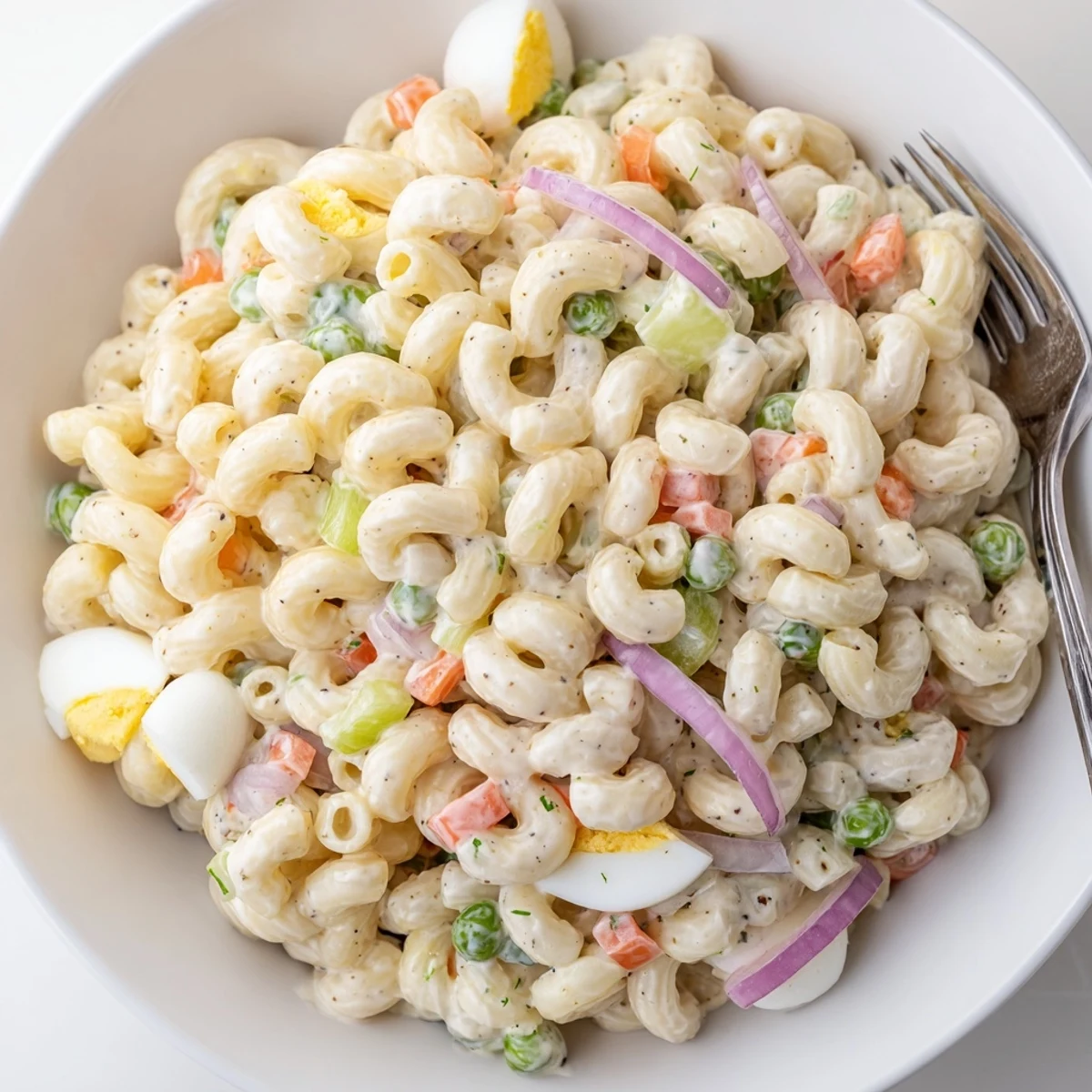 Creamy Macaroni Salad with crisp celery and peppers, ideal picnic side