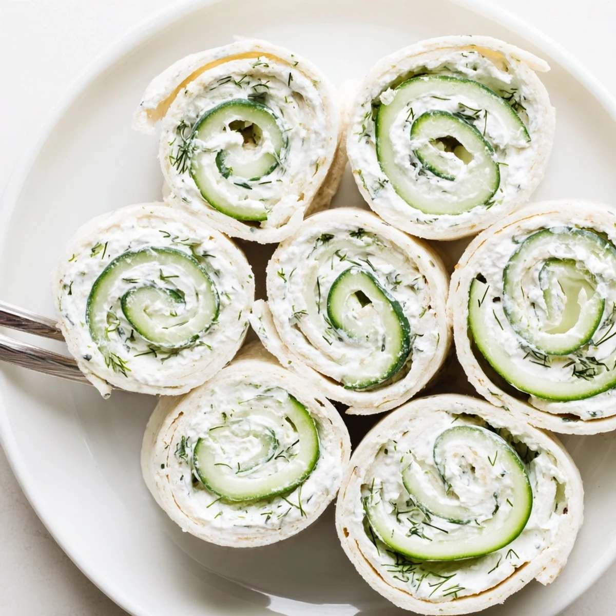 Chilled Cucumber And Dill Pinwheels with bright lemon notes, perfect party appetizer.