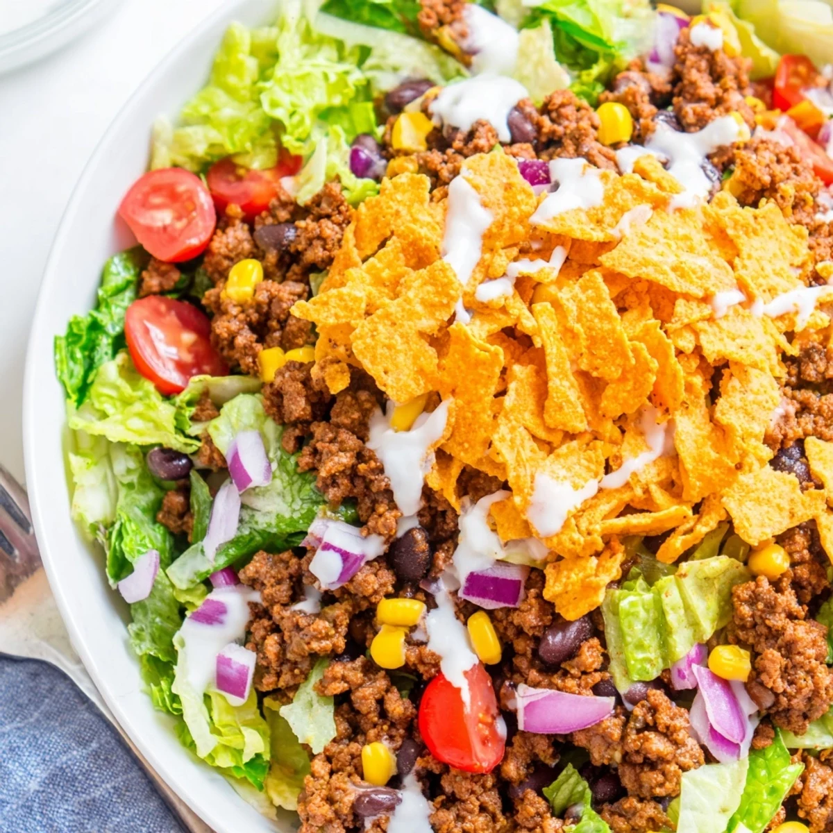 Fresh Simple Doritos Taco Salad tossed with warm beef, corn, zesty dressing