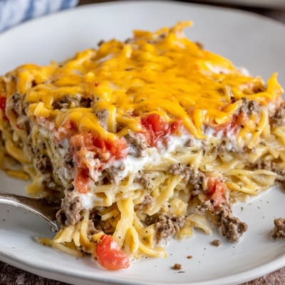 Hearty Beef Lombardi Casserole layered with noodles and creamy cottage cheese topping